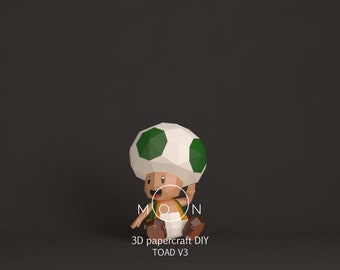 May include: A 3D papercraft DIY model of Toad from the Super Mario franchise. The model is green, white, and brown and is in a sitting position with one arm raised. The text "3D papercraft DIY TOAD V3" is below the model.