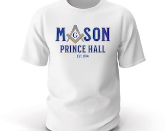 May include: White t-shirt with the words "MASON PRINCE HALL EST. 1784" in blue lettering. The design includes a compass and square symbol. The shirt is a classic crew neck style.