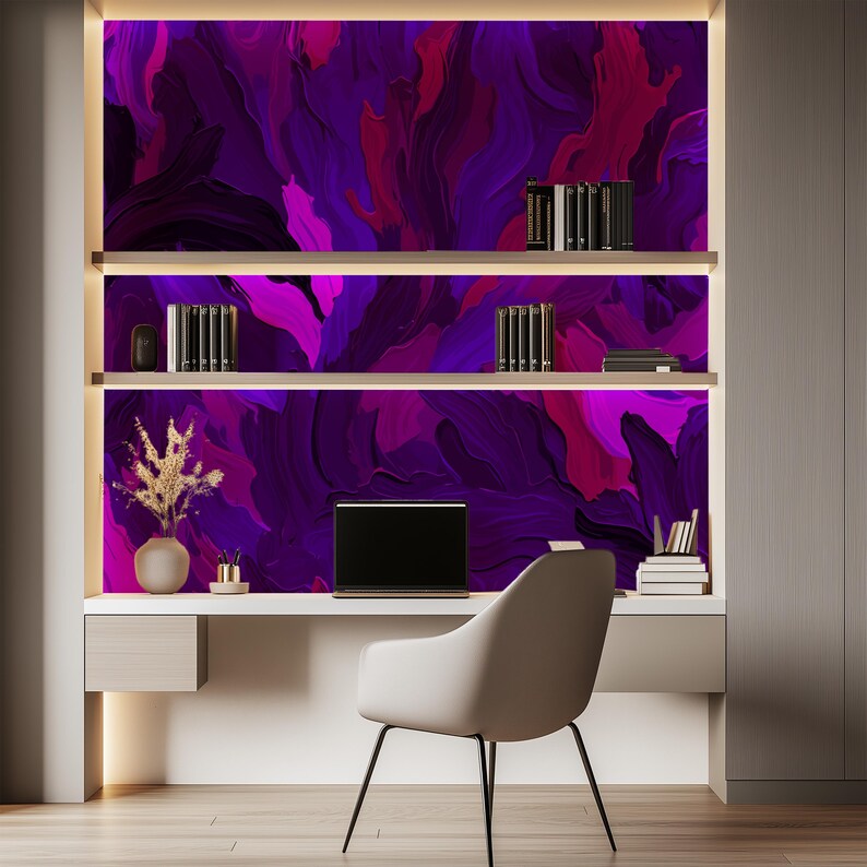 May include: A home office desk with a white chair and a computer monitor. The wall behind the desk is decorated with a colorful abstract painting in shades of purple, pink, and blue.