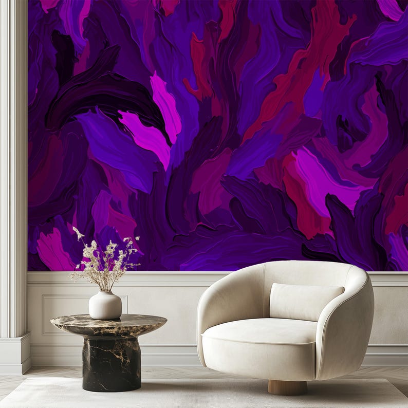 May include: A white armchair with a rounded back and a purple abstract painting on the wall behind it.
