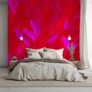 May include: A white bed with a brown headboard and white bedding. The wall behind the bed is painted with a red and pink abstract design.