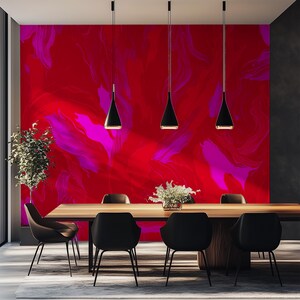 May include: A dining room with a red and pink abstract wall mural, a wooden table, and six black chairs. Four black pendant lights hang above the table.