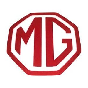 May include: A red and white octagonal logo featuring the letters "MG" in a bold, sans-serif font. The letters are red, and the background is white. The logo has a clean, modern design.