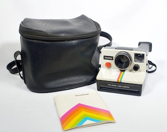 Fotocamera istantanea Polaroid OneStep SX-70 bianca e nera del 1978 con manuale
