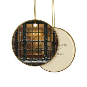 May include: A round ceramic ornament with a gold rim and a gold hanging cord. One side features a painting of a dark window frame looking into a warm, lit room with snow falling outside. The other side is cream-colored with black text reading: "...come! The game is afoot" and "SHERLOCK HOLMES".