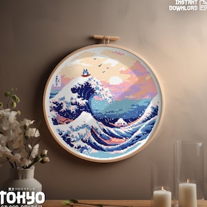 May include: A cross stitch pattern of the Great Wave off Kanagawa with a Totoro character on top of the wave. The pattern is framed in a round wooden hoop and is displayed on a wall.