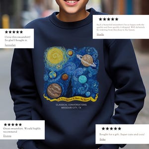 May include: A navy blue crewneck sweatshirt featuring a graphic print of a swirling starry night sky with various planets. A yellow banner contains the text "To Know God and To Make Him Known" above the text "CLASSICAL CONVERSATIONS MISSOURI CITY, TX".