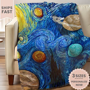 May include: A blue blanket with a swirling, starry night design, featuring yellow, orange, and teal accents. The blanket is draped over a beige sofa. The text "3 SIZES PERSONALIZE NOW" is visible.