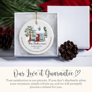 May include: White ceramic Christmas ornament with a watercolor illustration of a small house with a red door and snow-covered trees. The text "The Godwins" is written in black with the words "Homeschool Est. 2023" below. The ornament also includes the text "THE PURPOSE OF EDUCATION IS TO KNOW GOD AND TO MAKE HIM KNOWN."