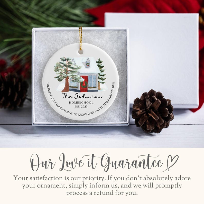 May include: White ceramic Christmas ornament with a watercolor illustration of a small house with a red door and snow-covered trees. The text "The Godwins" is written in black with the words "Homeschool Est. 2023" below. The ornament also includes the text "THE PURPOSE OF EDUCATION IS TO KNOW GOD AND TO MAKE HIM KNOWN."