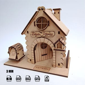 Könnte beinhalten: Ein Holzmodell eines Hauses mit einem Schild, auf dem "Ratón Pérez" steht, und einem kleinen Holzbriefkasten mit einem Zahn an der Seite. Das Haus hat eine Tür mit einem Fenster und einen Schornstein. Das Modell ist 3 mm dick und in den Formaten AI, SVG, CDR, PDF und DXF erhältlich.
