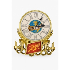 May include: A vintage Schlitz beer clock with a cream-colored face, Roman numerals, and a globe graphic. The clock has gold-colored hands and a gold-toned frame with a red and gold Schlitz logo. The clock is approximately 10 inches in diameter.