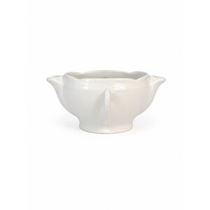 May include: A white ceramic gravy boat featuring a scalloped rim, a wide central body, and two curved handles on opposite sides. The vessel has a smooth, glossy finish and sits on a circular pedestal base, presenting a symmetrical design.
