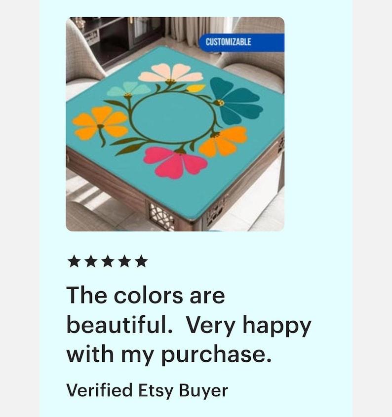 May include: A square table with a turquoise top featuring a floral design in pink, orange, and blue. The table has a dark wooden frame and is labeled "CUSTOMIZABLE".