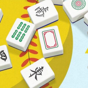 May include: A close-up of several white Mahjong tiles with various symbols and markings in green, red, and black. The tiles are arranged on a yellow and blue patterned surface, suggesting a game in progress.