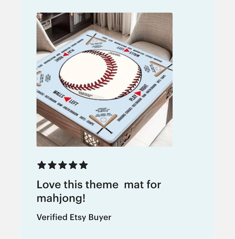 May include: A square light blue mahjong mat featuring a large central baseball graphic with red stitching. The mat includes printed text and illustrations of crossed baseball bats in each corner, with directional markers labeled PLAY RIGHT and WALLS LEFT.