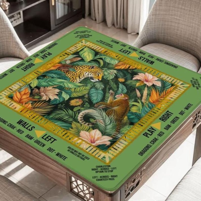 May include: A square green table with a jungle design featuring a leopard and monkey surrounded by foliage and flowers. The table's edges have text that reads "PLAY", "RIGHT", "WALLS", and "LEFT". The table is made of wood.