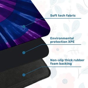 May include: A multi-layered mat featuring a top layer of soft tech fabric with a purple and blue abstract design, a middle layer of environmental protection XPE, and a bottom layer of non-slip thick rubber foam backing with a textured surface.