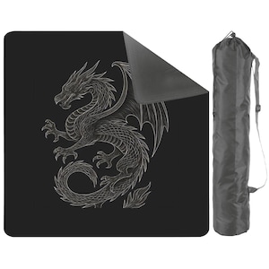 May include: Black yoga mat featuring a detailed white dragon illustration. The dragon is depicted with intricate scales, wings, and claws. A matching gray carrying bag with a shoulder strap is included, providing convenient storage and transport for the mat.