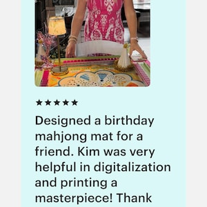 May include: A colorful mahjong mat with a birthday theme. The mat is on a table with a lamp and party hat. The text reads "Designed a birthday mahjong mat for a friend."