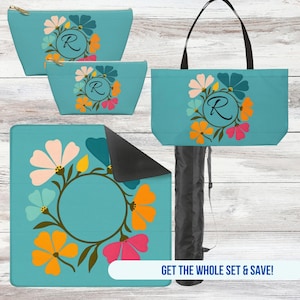 May include: A set of turquoise accessories featuring a floral wreath design with the letter "R". The set includes a tote bag, two cosmetic bags, and a blanket. The tote bag has black handles, and the blanket is folded with a black underside.
