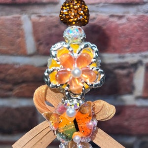 MOOIE BLING-PEN!!! Blingy oranje strass bloemenpen dubbelzijdig