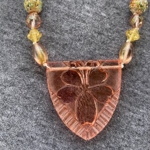 Vintage molded peach glass pendant with peach and yellow vintage glass beads and crystals