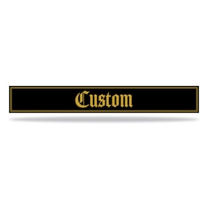 May include: Black rectangular sign with a gold border and the word "Custom" in gold lettering.
