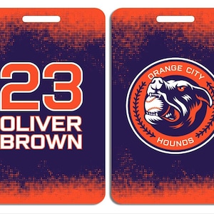 May include: A blue and orange baseball player ID card with the number 23, the name Oliver Brown, and a logo for the Orange City Hounds. The logo features a snarling dog with a baseball in its mouth.