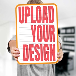 May include: A white dry-erase board with an orange frame. The board has a grid pattern and the words "UPLOAD YOUR DESIGN" in red letters.