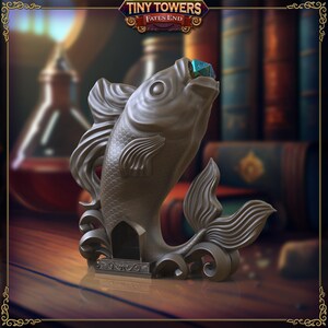May include: A gray 3D printed fish sculpture with an open mouth holding a blue and green gemstone. The fish is standing on a decorative base with intricate details. The sculpture is part of the Tiny Towers Fates End game.