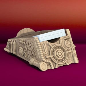May include: A steampunk-style card holder made of brown plastic with intricate gears and pipes. The holder has a slot for a stack of cards and a small clock face on the side.
