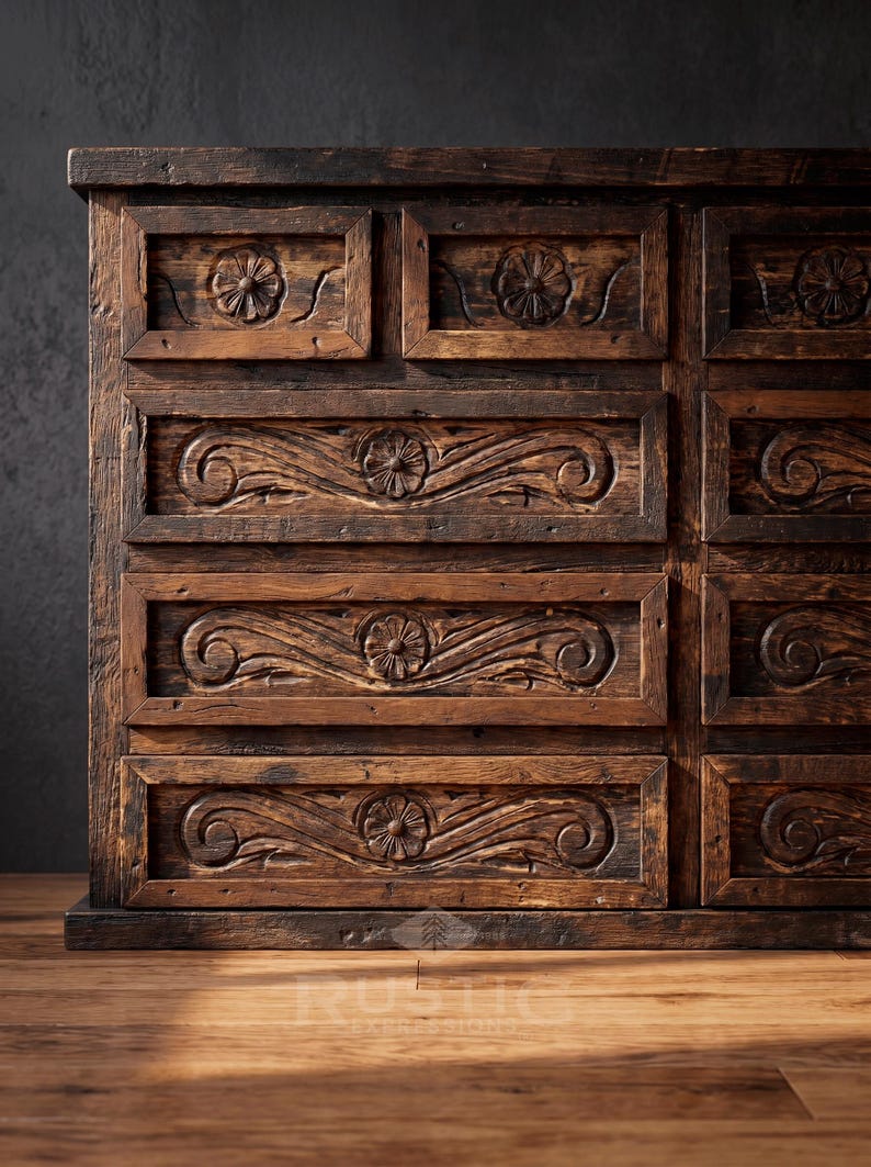 May include: A rustic, dark brown wooden dresser with carved floral and scrollwork details. The dresser has multiple drawers with recessed panels and decorative carvings, showcasing a vintage aesthetic.