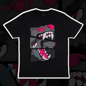 Könnte beinhalten: Schwarzes T-Shirt mit einem Grafikdruck eines Comic-Wolfskopfes im Comic-Stil. Die Augen des Wolfes sind rosa und seine Zähne sind spitz.