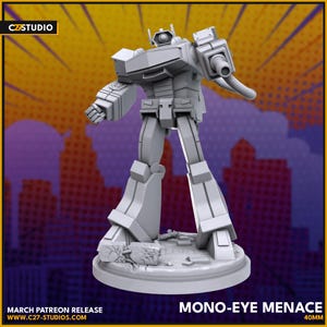 May include: A gray, 3D-printed robot figure, standing on a circular base with rubble details. The figure has a single eye and a large arm cannon. The text "MONO-EYE MENACE" and "40MM" are visible. The background is a comic book style cityscape.