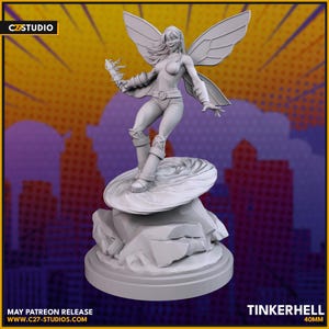 May include: A gray figurine of a female character with large wings, boots, and a belt. The figure is standing on a rock formation. The text "TINKERHELL" and "40mm" are visible. The image also includes the text "MAY PATREON RELEASE" and "WWW.C27-STUDIOS.COM".