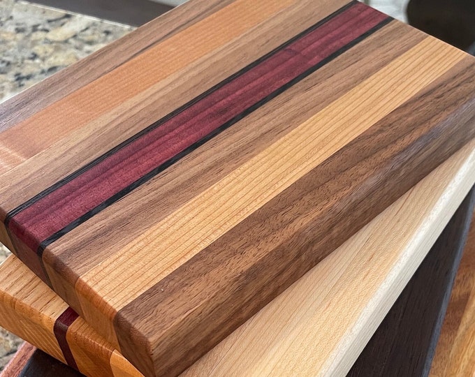 Featured listing image: Design your own small hardwood cutting board - Maple, Walnut, Cherry, Purpleheart options. 9” x 6” and offered in 3/4” or 1.5” thickness