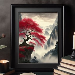 May include: A framed painting depicting a red tree growing on a cliff overlooking a misty valley. The tree has a thick trunk and branches that reach out towards the viewer. The valley is filled with fog and the mountains in the distance are obscured by the mist.