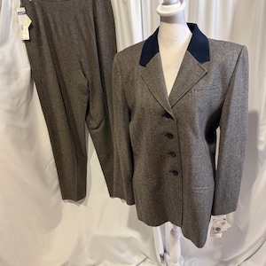 May include: A set of three ceramic mugs with a speckled, matte finish. The mugs are in shades of pink, with a minimalist design. Each mug has a rounded handle and a smooth interior.