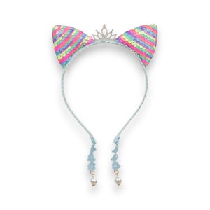 May include: A whimsical headband featuring cat ears adorned with colorful sequins in shades of pink, yellow, green, and blue. A silver tiara sits between the ears. The headband has light blue ties with floral accents and faux pearl drops.