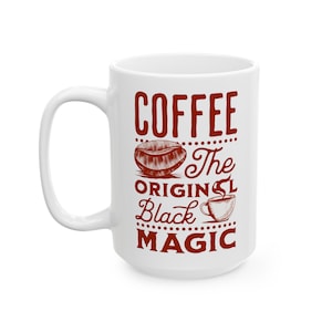 May include: White ceramic coffee mug with a red design that says "Coffee The Original Black Magic". The design includes a coffee bean and a cup of coffee.