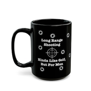 May include: Black ceramic coffee mug with a white target and the text "Long Range Shooting Kinda Like Golf, But For Men".