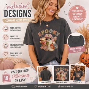Puede incluir: Una camiseta gris carbón de manga corta con el gráfico de un fantasma que lleva una gorra de béisbol y sostiene una bebida. El fantasma está decorado con un colorido patrón de patchwork. La palabra SPOOKY aparece en una fuente de patchwork.
