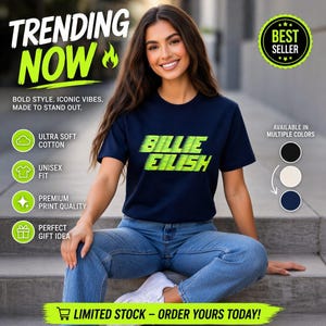 Puede incluir: Una camiseta azul marino con el texto "BILLIE EILISH" en verde neón. La camiseta se combina con vaqueros azules y zapatillas blancas. La imagen incluye texto que dice "TENDENCIA AHORA" y "MÁS VENDIDO".