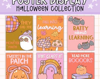 May include: A poster display featuring a Halloween collection with six colorful designs. Each poster has a unique illustration and text, including a ghost, mushrooms, bats, a pumpkin, a rainbow, and books. The text includes phrases like "Monster Mash" and "Read More Boooks."