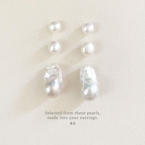 May include: Six white pearls of different shapes and sizes are arranged on a light background. The pearls vary from small, round ones to larger, irregular baroque pearls. Text at the bottom reads: "Selected from these pearls, made into your earrings. #6"