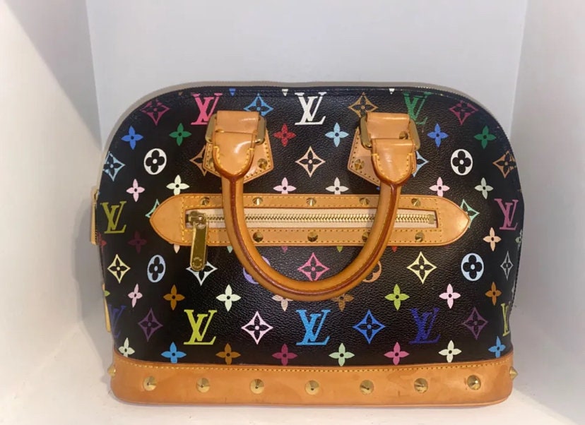 Louis Vuitton Kirigami canvas monogram large – VintageBooBoo Pre owned  designer bags, shoes, clothes