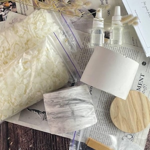 Luxury candle making kit with marble jar and soy wax displayed with tools and ingredients.