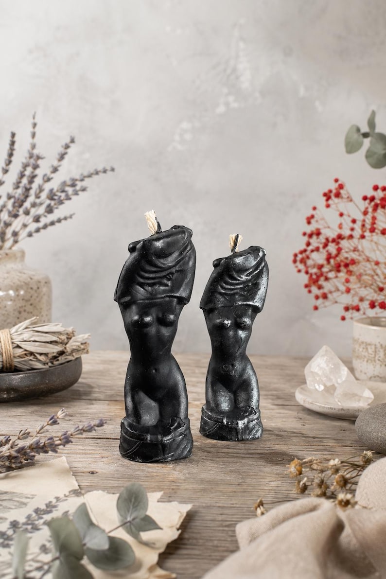 Set of two Black Female Torso Candles with silver highlights, handcrafted sculptural body candles styled with sage, lavender, crystals and botanical decor for feminine energy rituals, self-love, empowerment, spiritual practice and gothic altar styling
