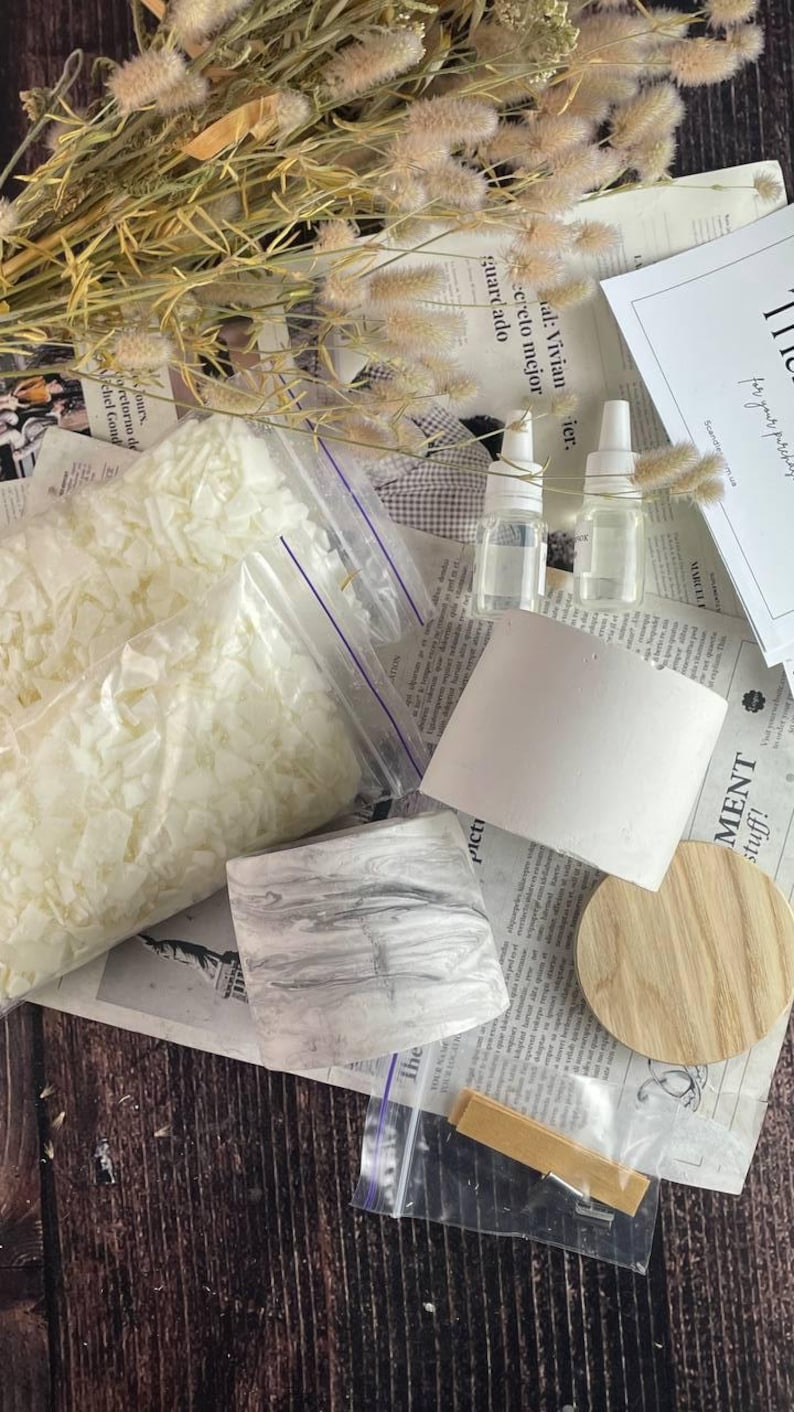 Luxury candle making kit with marble jar and soy wax displayed with tools and ingredients.